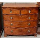 An early 19th Century bow front mahogany chest of