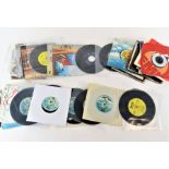 A collection of 45's, various artists and record l