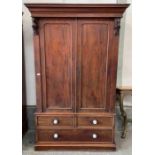 A Victorian mahogany two door wardrobe, with one l