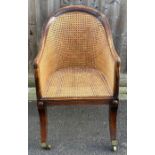 A 19th century mahogany bergere chair, with a cane