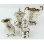 A silver two handled trophy cup, two silver pepper