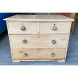 A Victorian pine chest of drawers, set with three