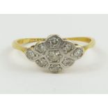 An Edwardian diamond cluster ring, in a flat setti