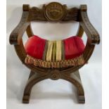 A 20th century Savonarola carved armchair, with a