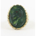 A 9ct gold signet ring set with an oval bloodstone