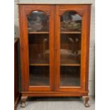 An early 20th Century red walnut bookcase with adj