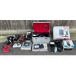 A collection of cameras and camera accessories