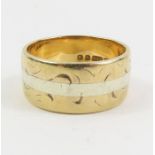 A 9ct two colour gold wedding band, 7mm wide, fing