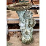 A stone effect bird bath on support moulded with f