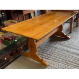 A rectangular pine trestle style table 183cm x 80.