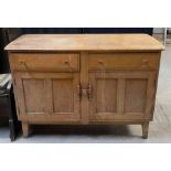 An Ercol light wood sideboard fitted with dr
