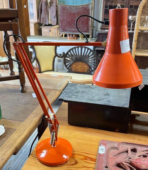 An orange anglepoise lamp