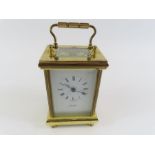 A 20th century timepiece, in a brass case by Alexa