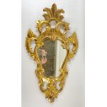 A Florentine style giltwood framed wall mirror ove