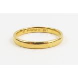 A 22ct gold wedding band, finger size Q leading ed