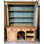 A Victorian painted and stripped pine kitchen dresser
