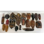 A collection of decorative African carved wood mas