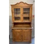 An early 20th century stripped pine dresser having