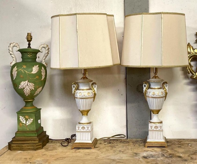 A pair of Italian white porcelain and gilt painted