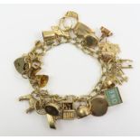 A 9ct gold charm bracelet and charms, charms to in