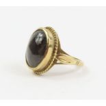 A 9ct gold black hardstone ring, finger size O 1/2