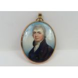 An early 19th century oval miniature portrait on i