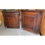 A George III oak wall hanging corner cupboard, the