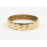 A 9ct gold patterned wedding band, finger size Q,