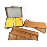 A Mah Jong set in case together with four wooden t