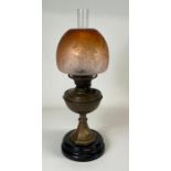 A late 19th/early 20th century oil lamp having bra