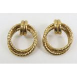A pair of 9ct gold earrings, formed as two hoops w