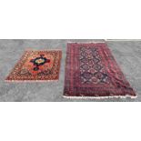 A Middle Eastern wool rug in light red/blue/green