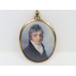 An early 19th century oval miniature portrait on i
