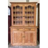 A stripped pine kitchen dresser the top with glaze