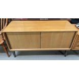 A Gordon Russell sideboard having low raised back,