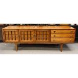 A mid century sideboard by Younger having decorati