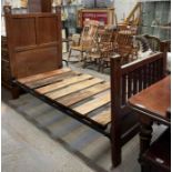 An Arts & Crafts oak single bed, the head and foot