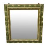 A 19th century wood framed wall mirror with later