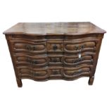 An 18th century French oak serpentine commode,