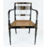 A 19th century ebonised wood frame chair with cane