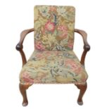 An 18th century style walnut low open armchair, st