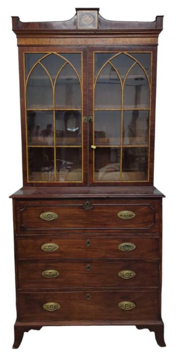 An early 19th century mahogany secretaire bookcase