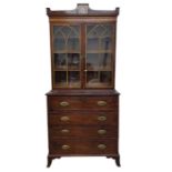 An early 19th century mahogany secretaire bookcase