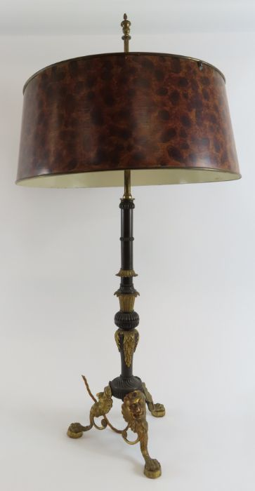 A decorative bronze and gilt metal table lamp, the