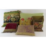 A group of small decorative cushions including som
