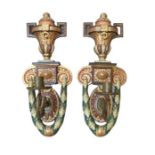 A pair of 20th century painted wall lights, each w