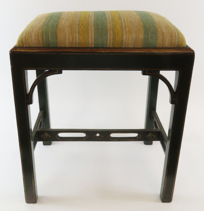 A painted wood stool with drop-in upholstered seat