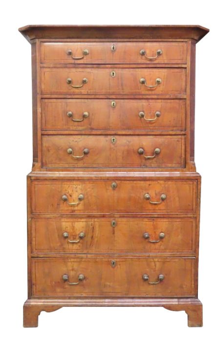 An early 18th century walnut tallboy fitted with