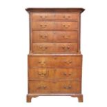 An early 18th century walnut tallboy fitted with