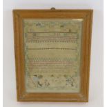 A George III sampler sewn with coloured silk wool